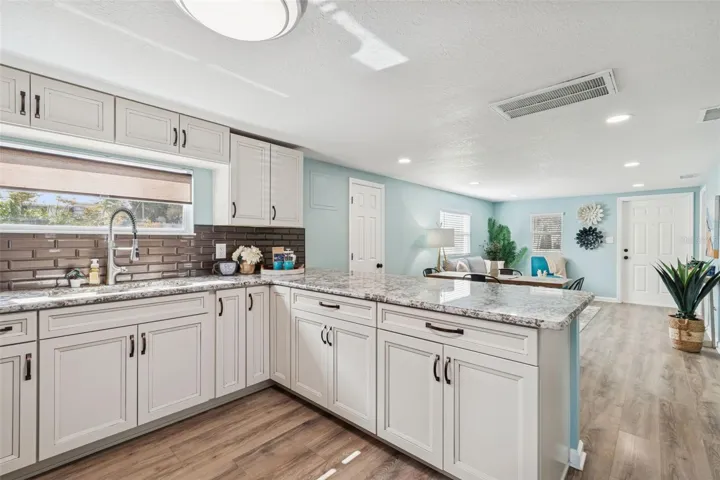 Solid wood kitchen cabinets w/ soft close doors, drawers, pull outs, and lazy susan.