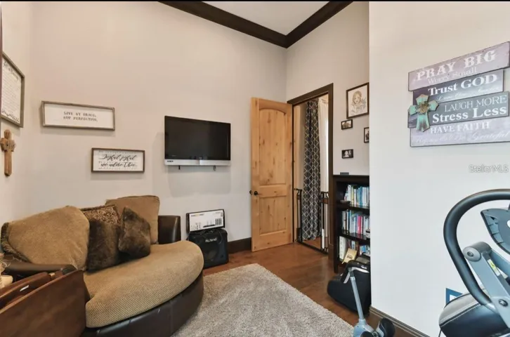 bonus room behind fireplace in family room