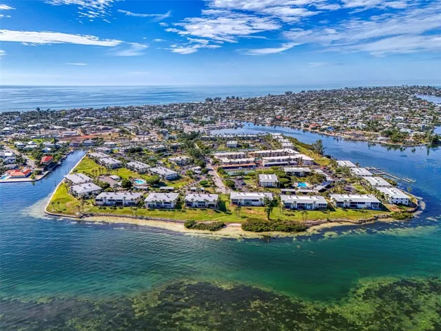 Westbay Point & Moorings is located on Anna Maria Sound. Unit 126 is on the left with the pool directly behind it. Gulf of Mexico beaches are in the distance.