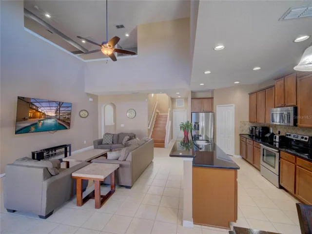 Kitchen and Living Room Showing Staircase Location