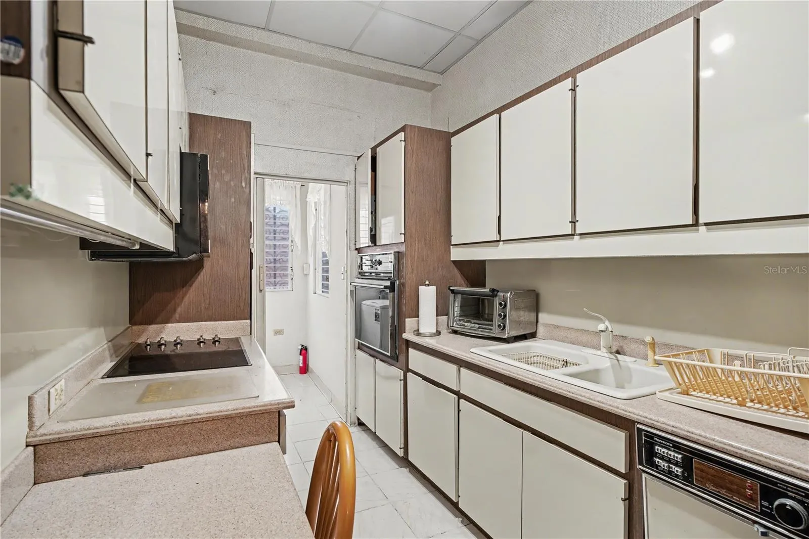 Galley-style kitchen with efficient layout and ample cabinetry.