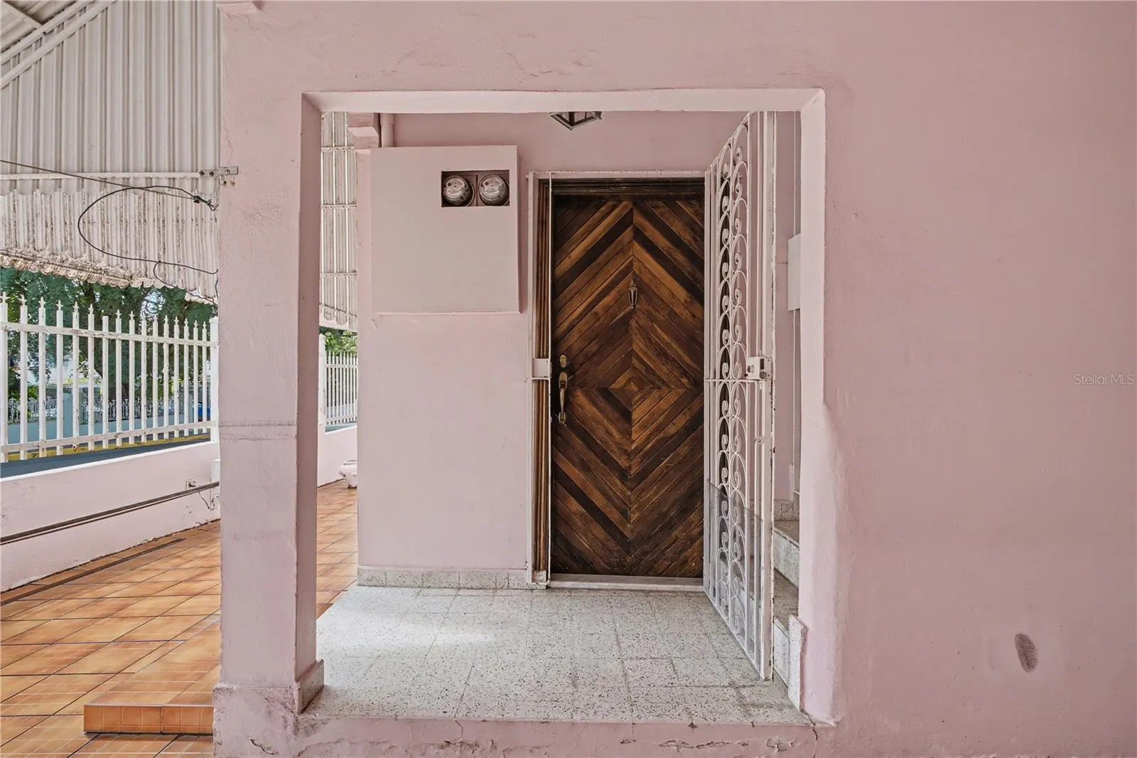 First-floor entrance with solid wood door in historic property