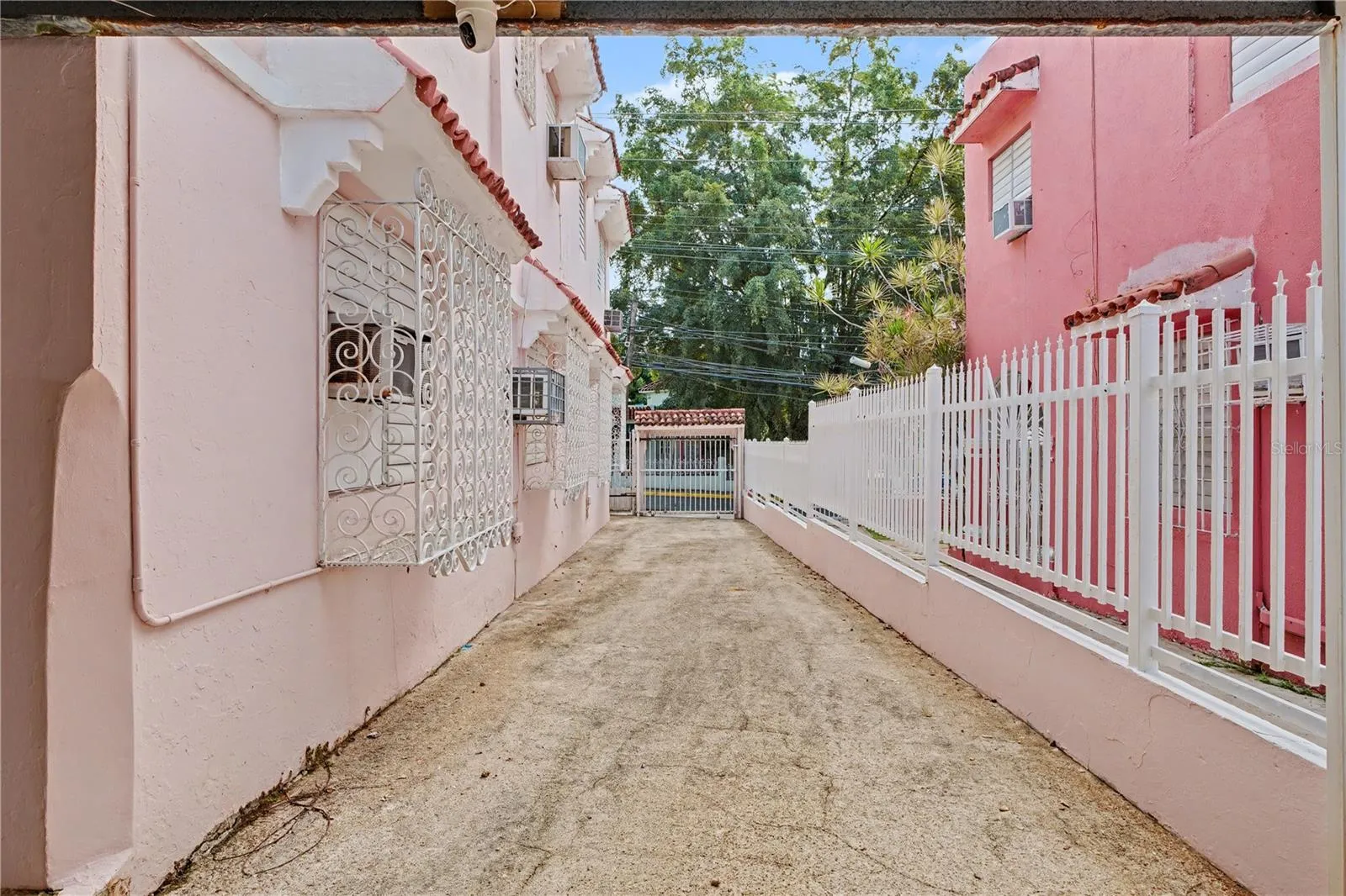 Driveway view toward gated street access.