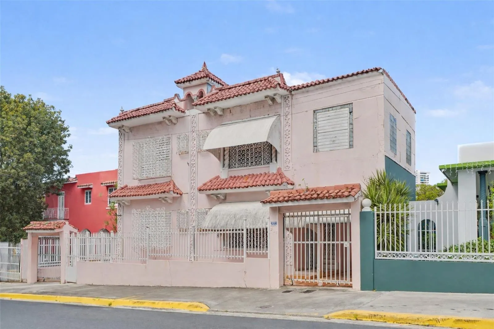 Historic urban home front elevation with decorative ironwork