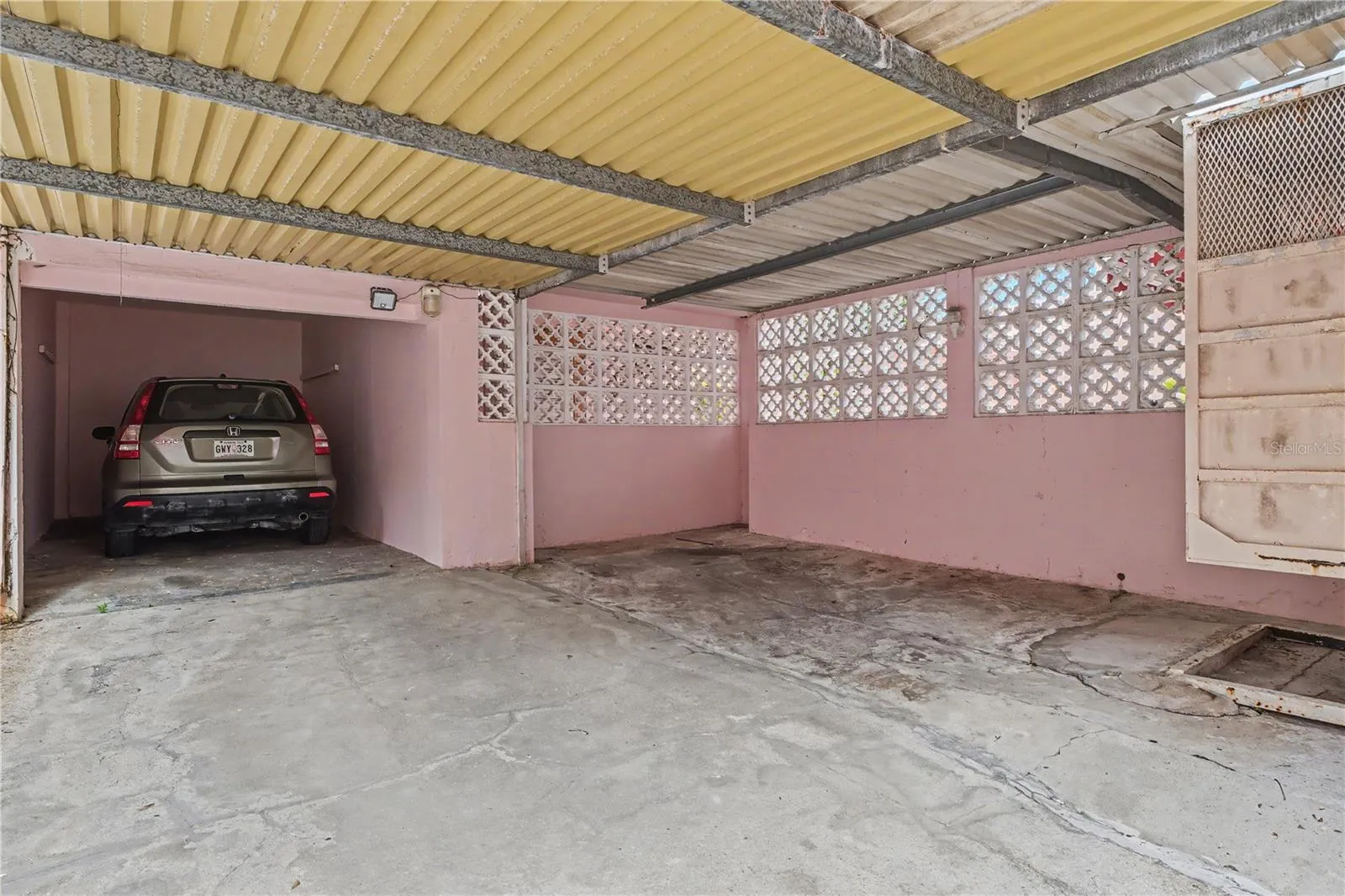 Covered Carport AreaCovered carport providing sheltered parking and utility space or additonal parking space