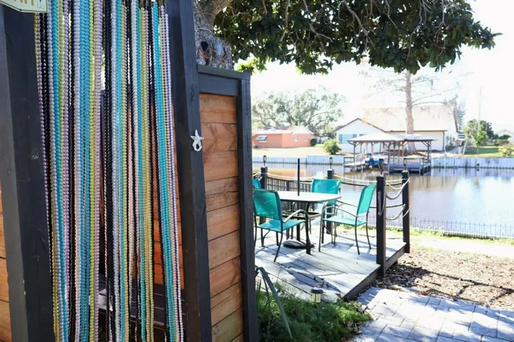 Outdoor shower entrance with deck overlooking lake
