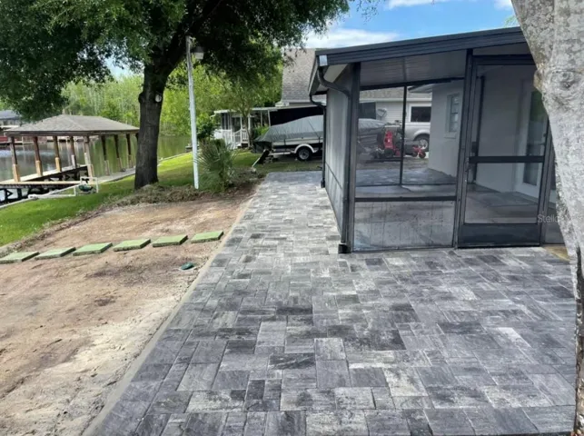 Brick pavers installed in 2023 … screen enclosure being painted & re-screened