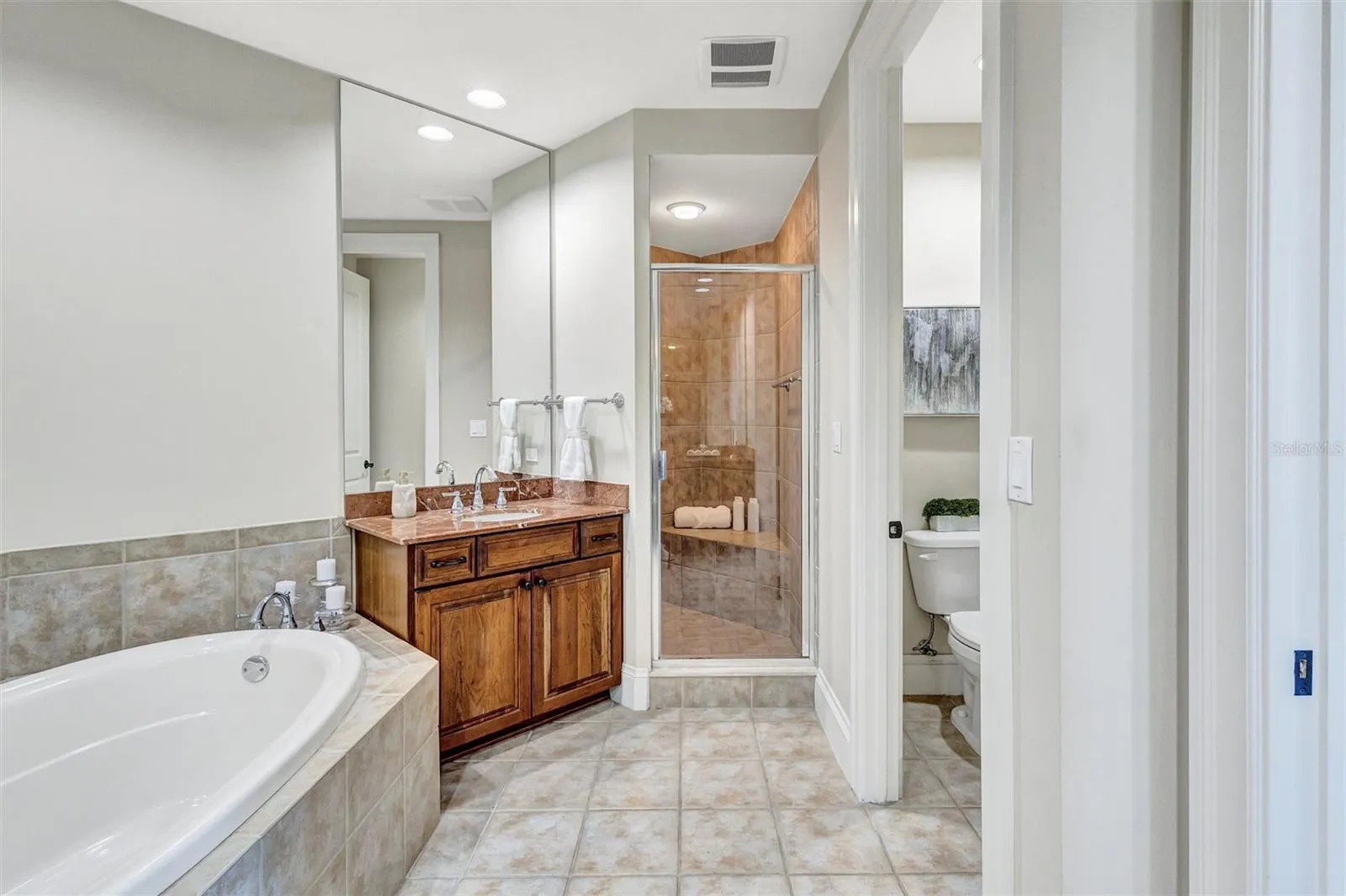 Ensuite Bath with Dual Sinks, Vanity, Soaking Tub, Separate Shower and Water Closet