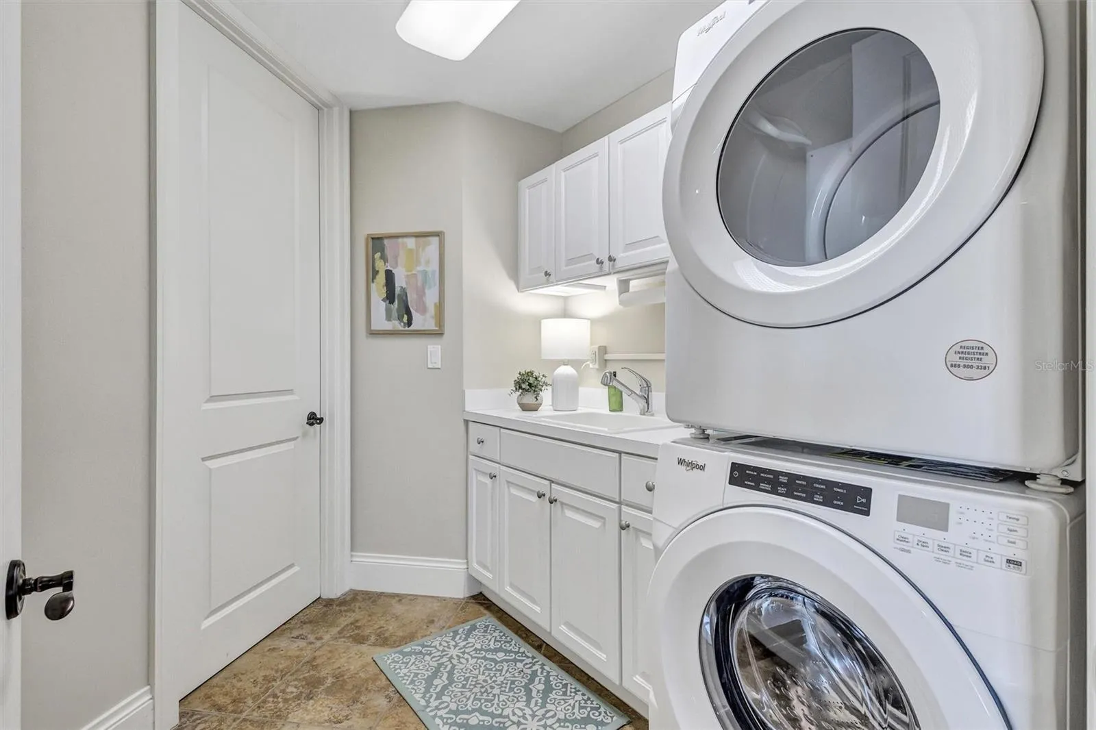 Laundry Room with utility sink and plenty of storage