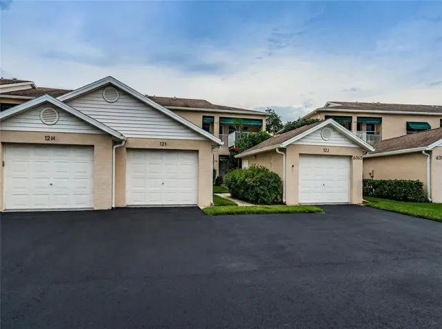 Private one-car garage with additional attic storage. Rare combination of three bedrooms, garage, and waterfront views.