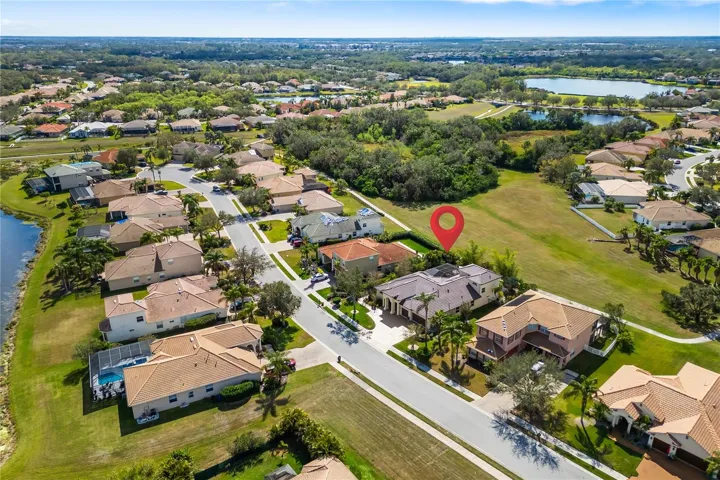 Luxury living just became more attainable in Greyhawk Landing, repositioned spacious 4 bedroom multigeneration spacious home with heated lap pool 12810 Daisy Pl, Bradenton, FL 34212