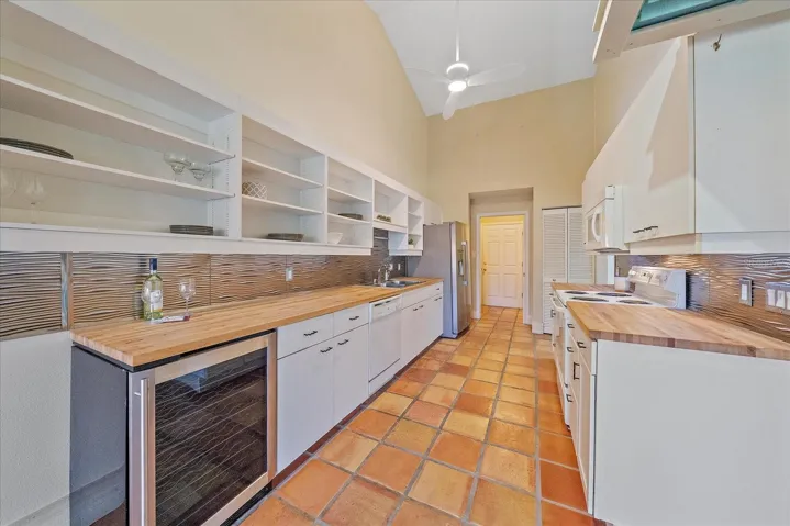 Large kitchen with butcher block counters