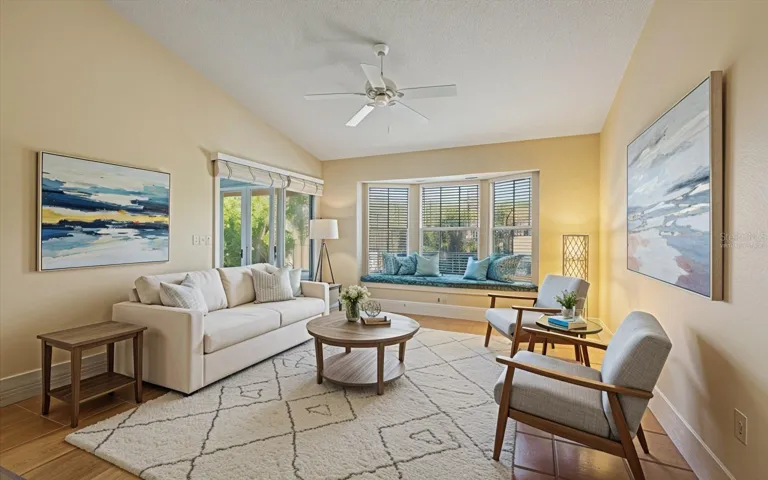 virtually staged - sitting room with a lake view