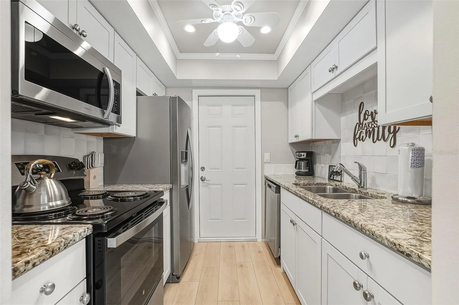 Fabulous, updated kitchen with new stainless appliances and stone countertops.