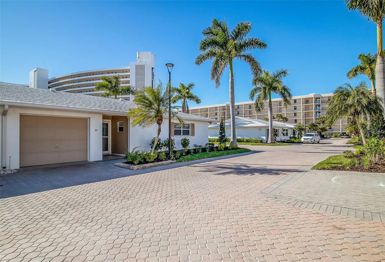 Completely updated villa with a 1-car garage and enclosed Florida room.  Short walk to the beach and one of two community pools.