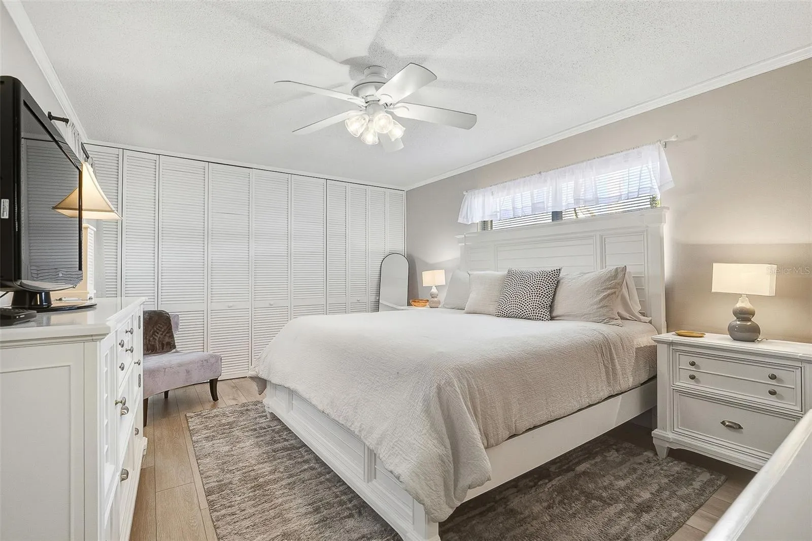 The primary bedroom offers a large closet and private ensuite bath.