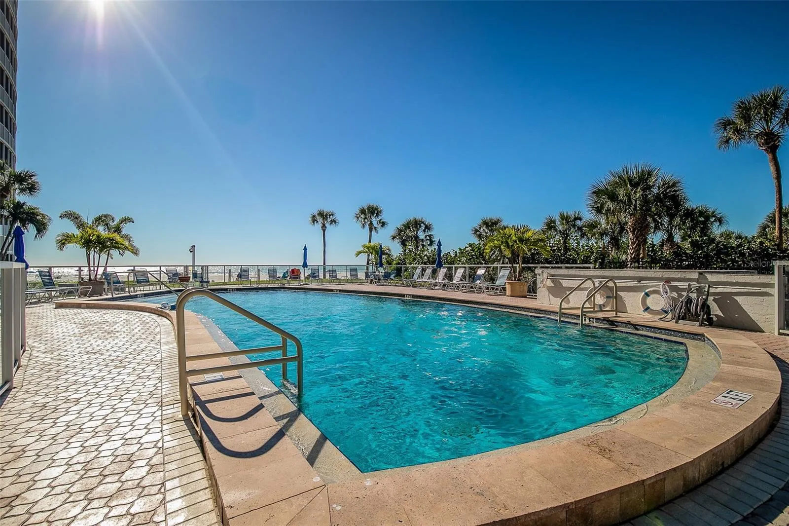 The community heated pool overlooks the beach and Gulf.