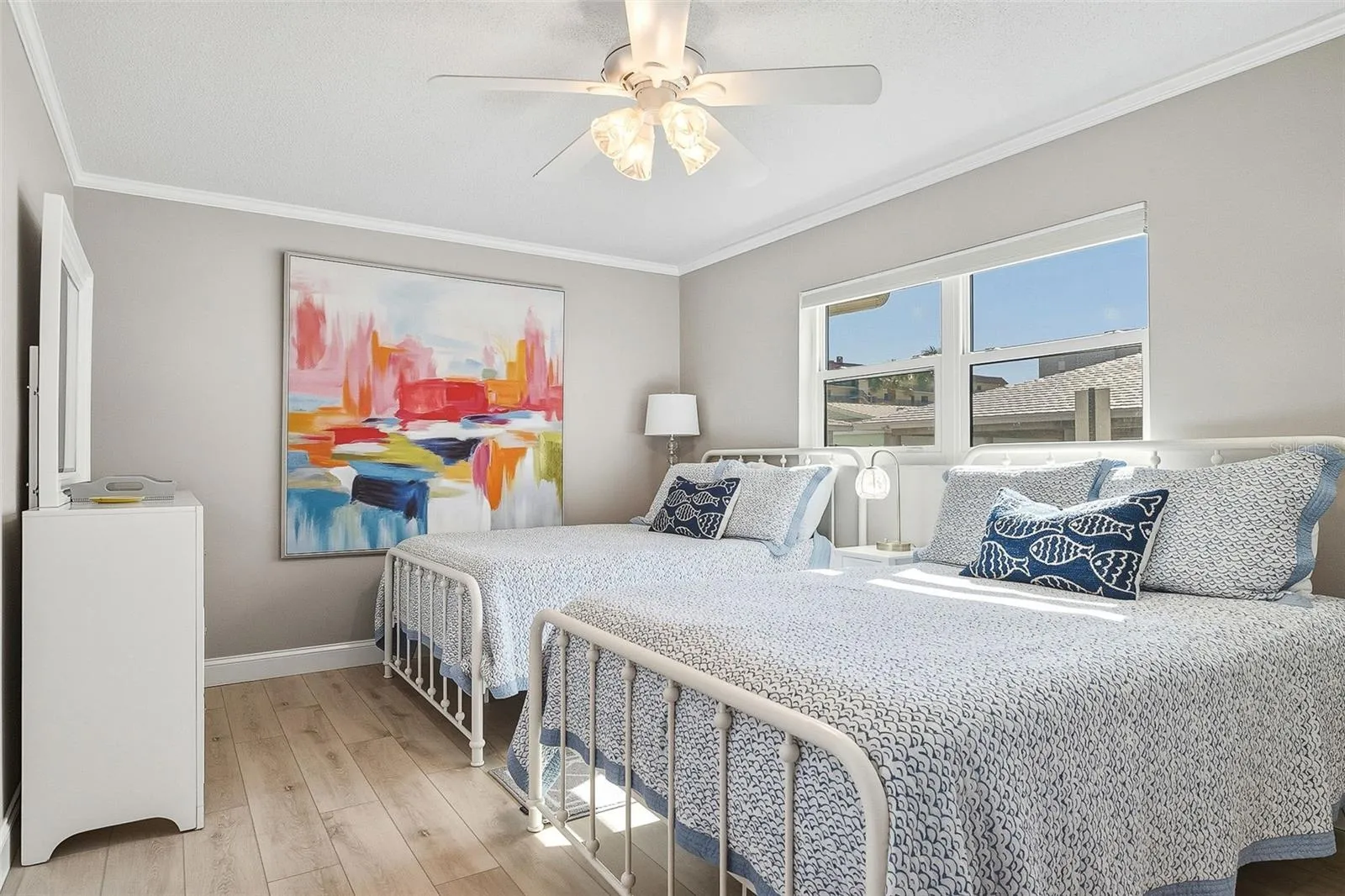 Spacious guest bedroom fits two full size beds and offers a private ensuite full bath.
