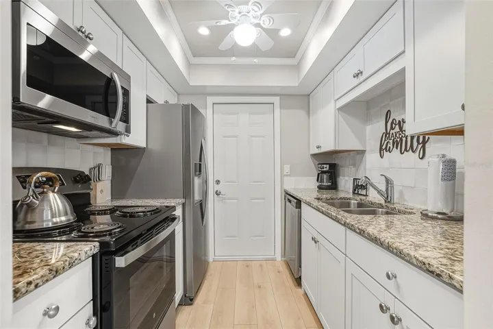 Fabulous, updated kitchen with new stainless appliances and stone countertops.