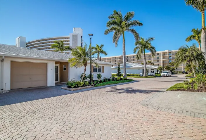 Completely updated villa with a 1-car garage and enclosed Florida room.  Short walk to the beach and one of two community pools.