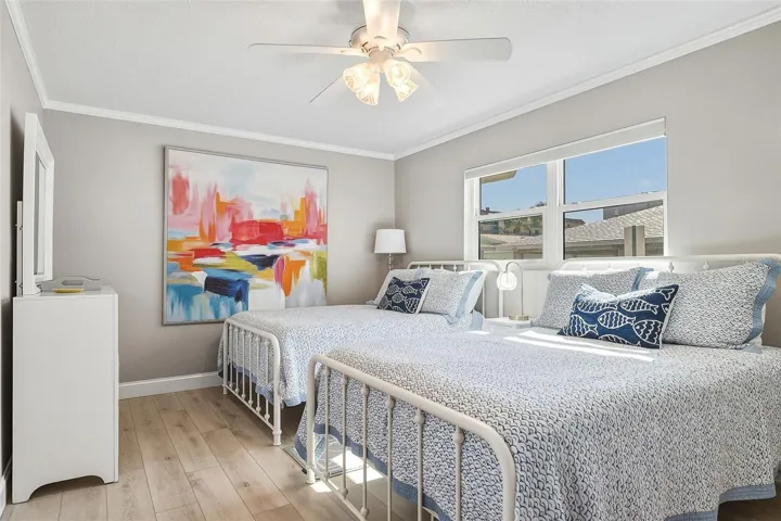 Spacious guest bedroom fits two full size beds and offers a private ensuite full bath.