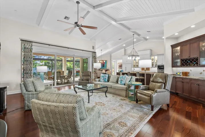 Living Room into Kitchen with Soaring Cathedral Ceilings