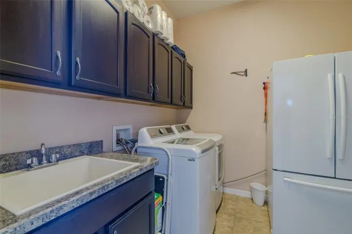 big laundry with refridgerator
