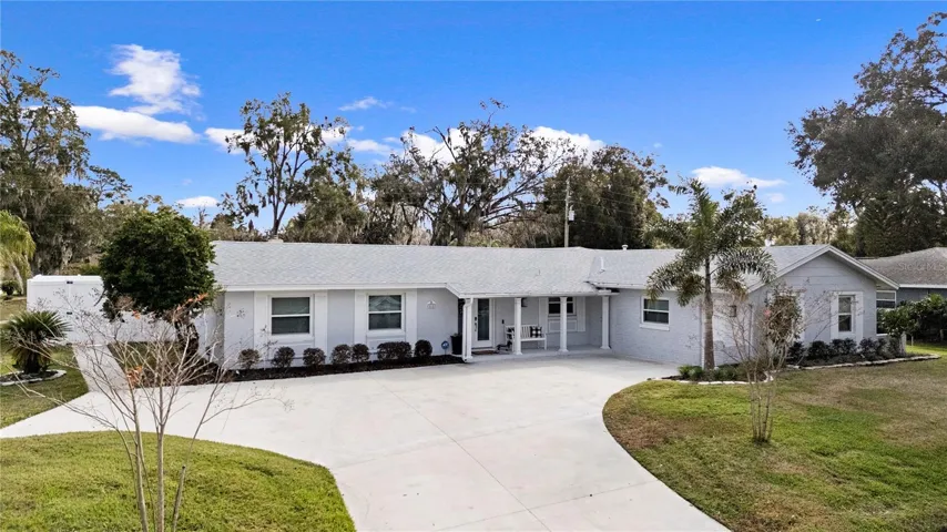 Front of the home with large parking area!