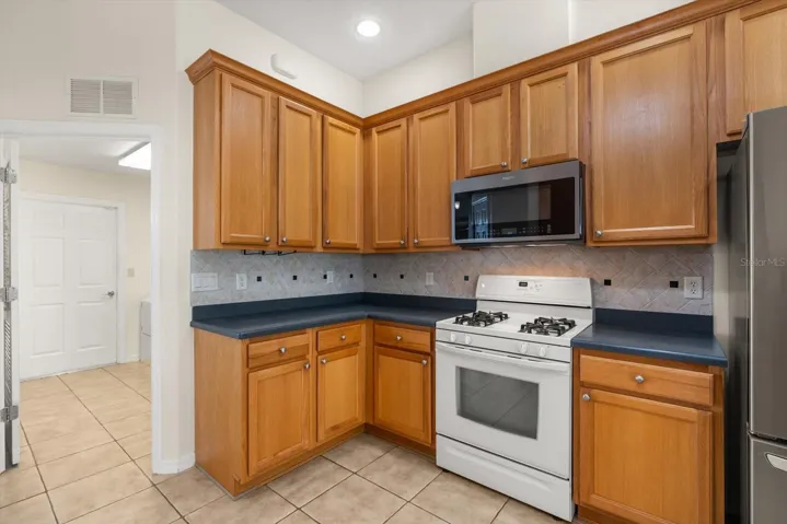 Additional kitchen angle with abundant cabinetry