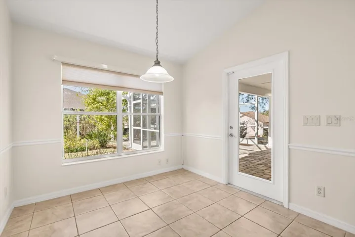 Bright breakfast nook with outdoor views