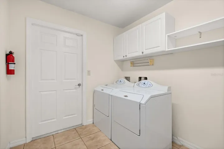 Large laundry room with storage