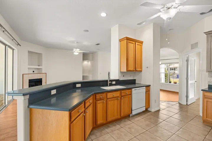 Large kitchen with breakfast bar and Corian counters
