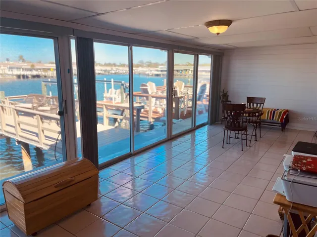 Stepping out of the primary bedroom into the bonus, enclosed Florida room!