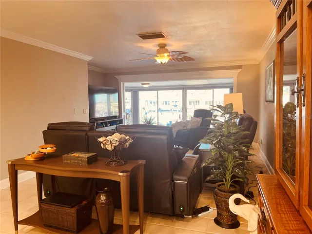 Standing in your dining room, looking through the living room to the three sets of sliders and your gorgeous water view!