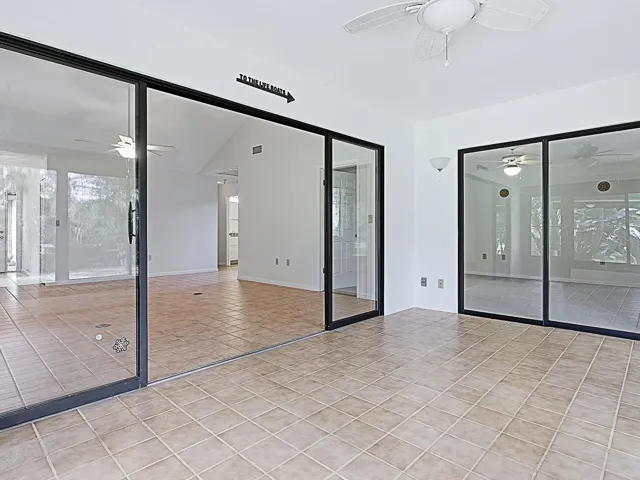 Florida room showing glass doors to Living room and Primary bedroom