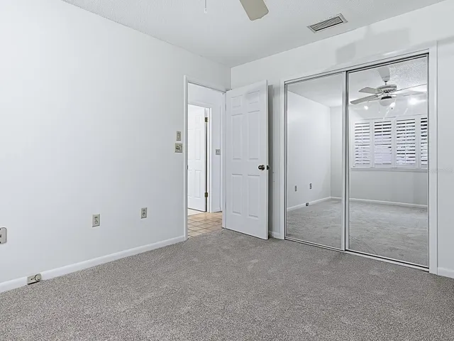 Bedroom 2  with mirrored closet doors