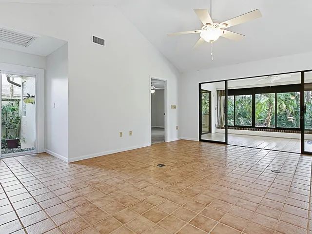 Living room with view of Florida room glass doors