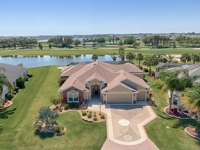 FRONT EXTERIOR - 3126 Ranchwood Terrace, VILLAGE of GILCHRIST - Expanded LANTANA Designer w/ 3 BR/ 3 BA/ 2.5 Car Garage , GOLF COURSE FRONTAGE/WATER VIEW & 3060 sf of living area on 0.348 acre CUL-DE-SAC LOT