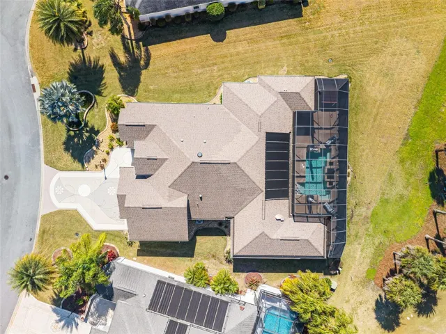 HIGH OVERHEAD AERIAL shows oversized lot ~0.348 acre w/ Evans Prairie Championship Golf Course Frontage