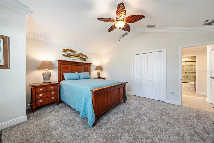 Another view of BEDROOM #2 shows CATHEDRAL CEILING, CLOSET w/ bifold doors, and door to HALLWAY (far R)