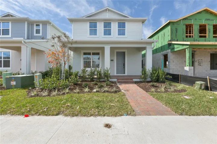 Charming coastal bungalow exterior style with beach-inspired detailing and sunny curb appeal