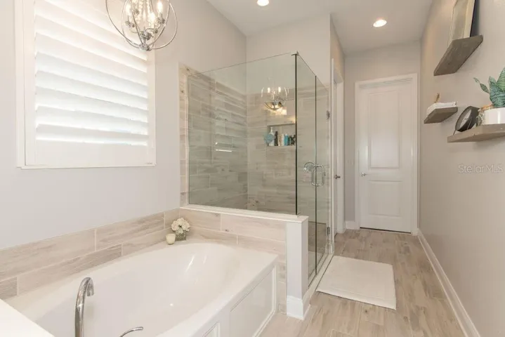 PRIMARY BATHROOM WITH CUSTOM WALK-IN CLOSET