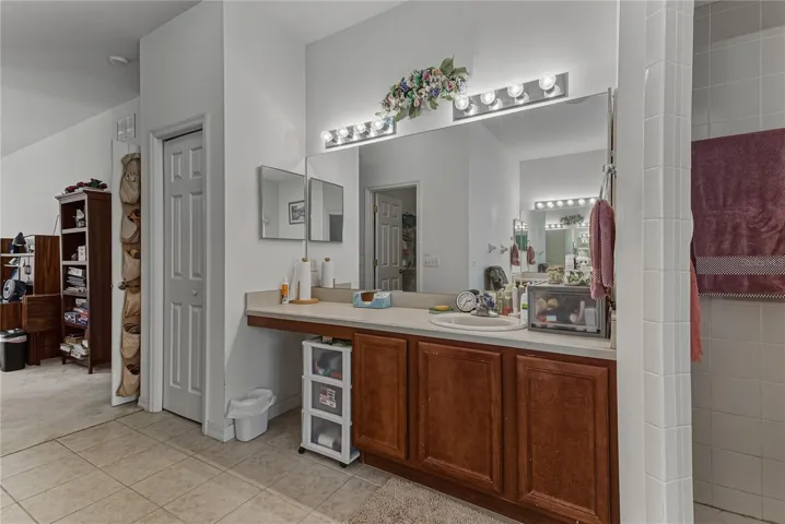The primary bath has a linen closet and a makeup area.