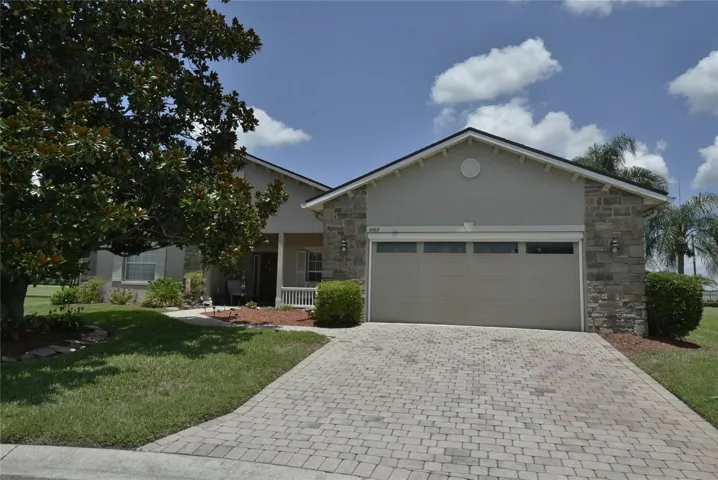 This unique alternate front elevation TAHITI floor plan home is located on a pie shaped oversides pond and golf course frontage lot.
