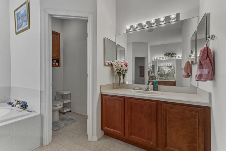 The second vanity is on the opposite wall from the other vanity.