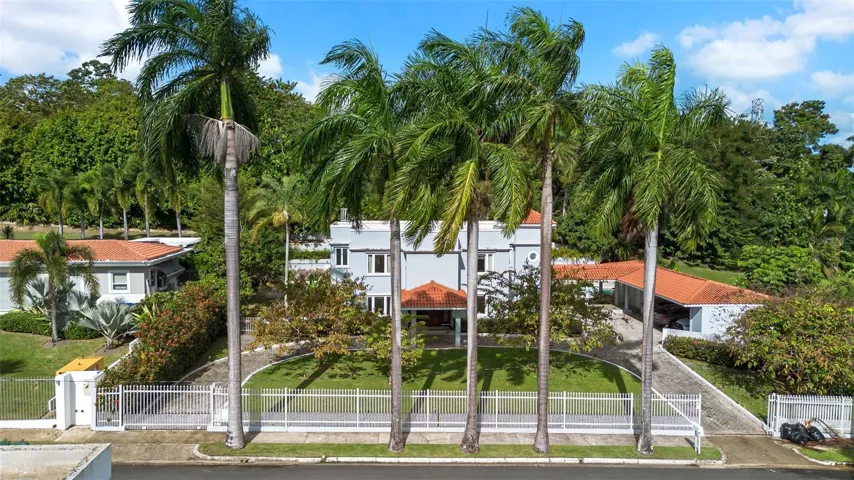 An expansive view of this stunning property, highlighting the spacious lot, inviting outdoor areas, and unbeatable location.