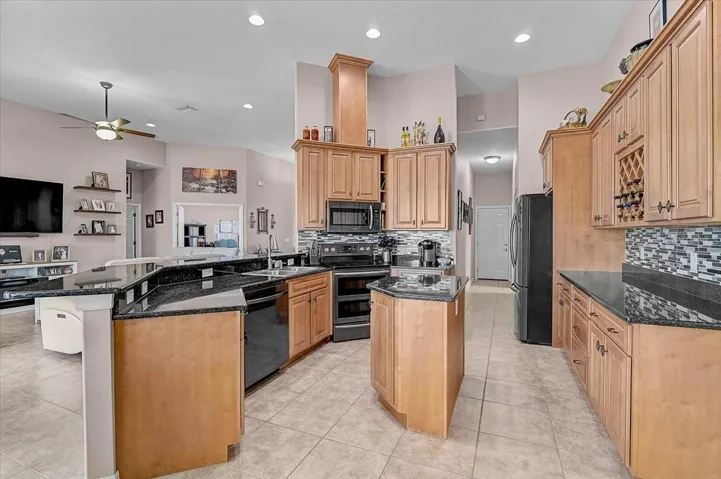 Great room, kitchen, and the French doors lead to the office