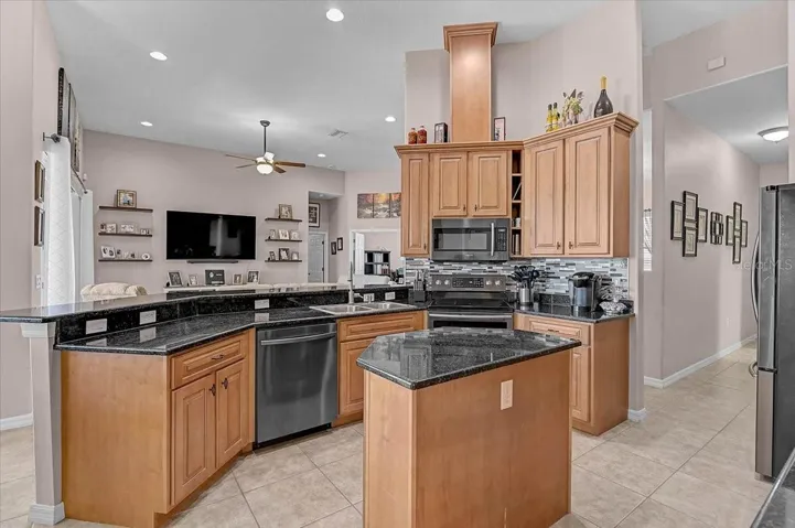 The kitchen is centrally located for easy access to all rooms