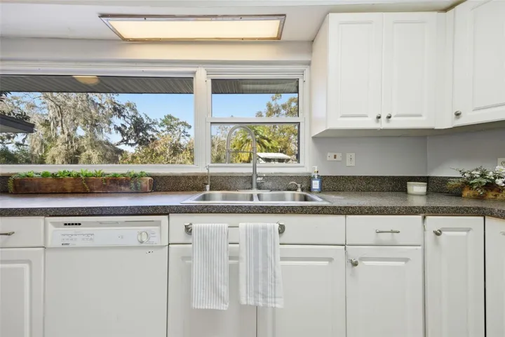 Kitchen with gorgeous window looking out to front yard
