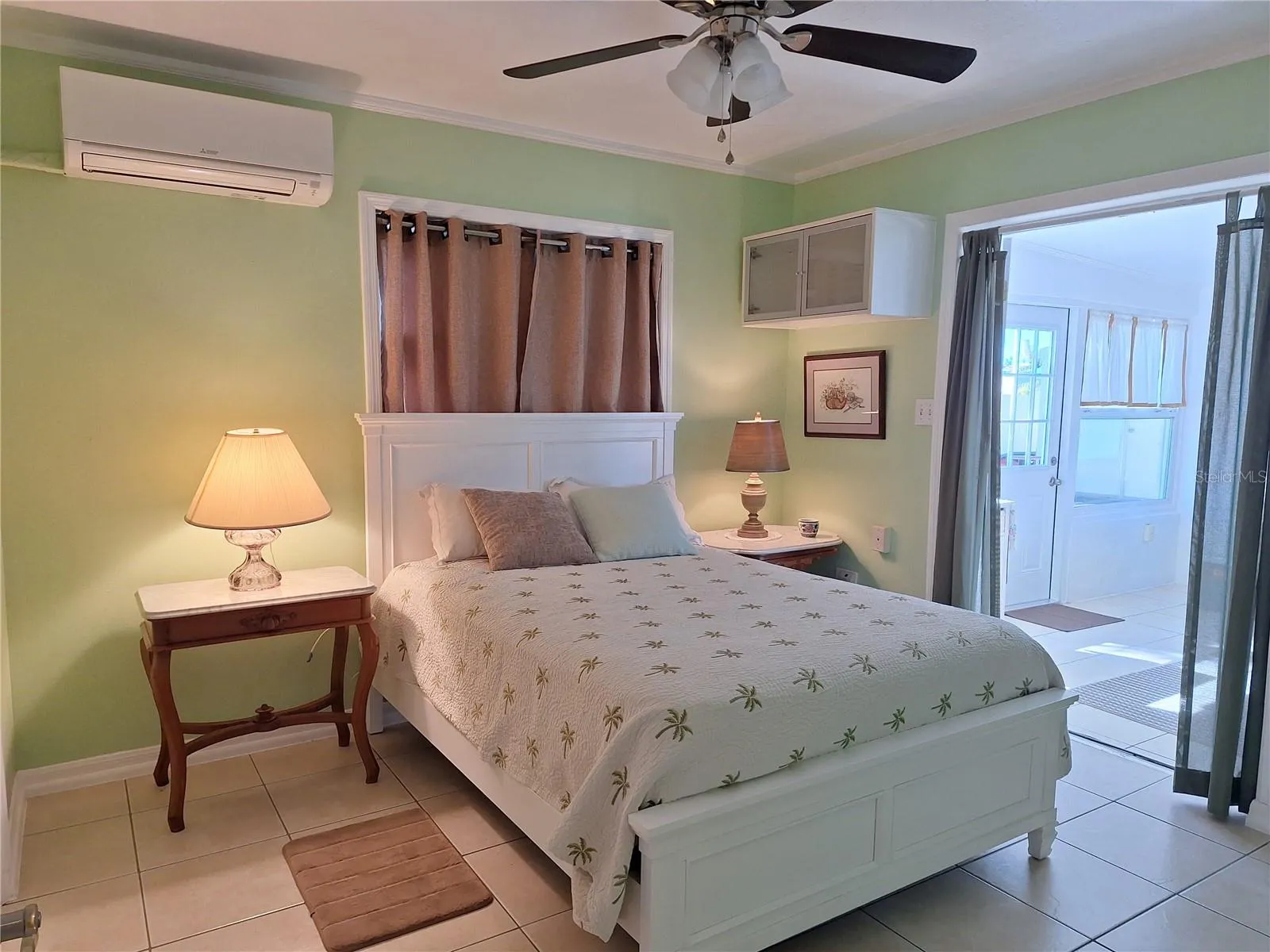 Bedroom #2 with access to sunroom and side entry to house